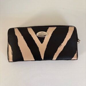 Coach Accordion Zip Wallet featuring a zebra print design